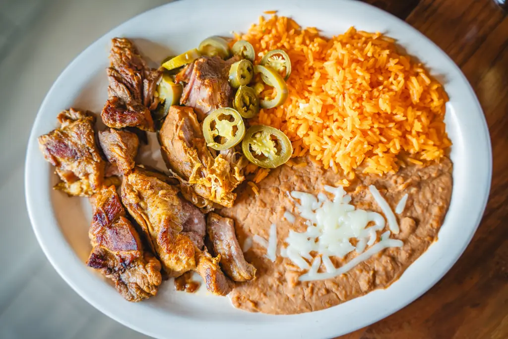 Roasted pork with jalapenos, rice and beans